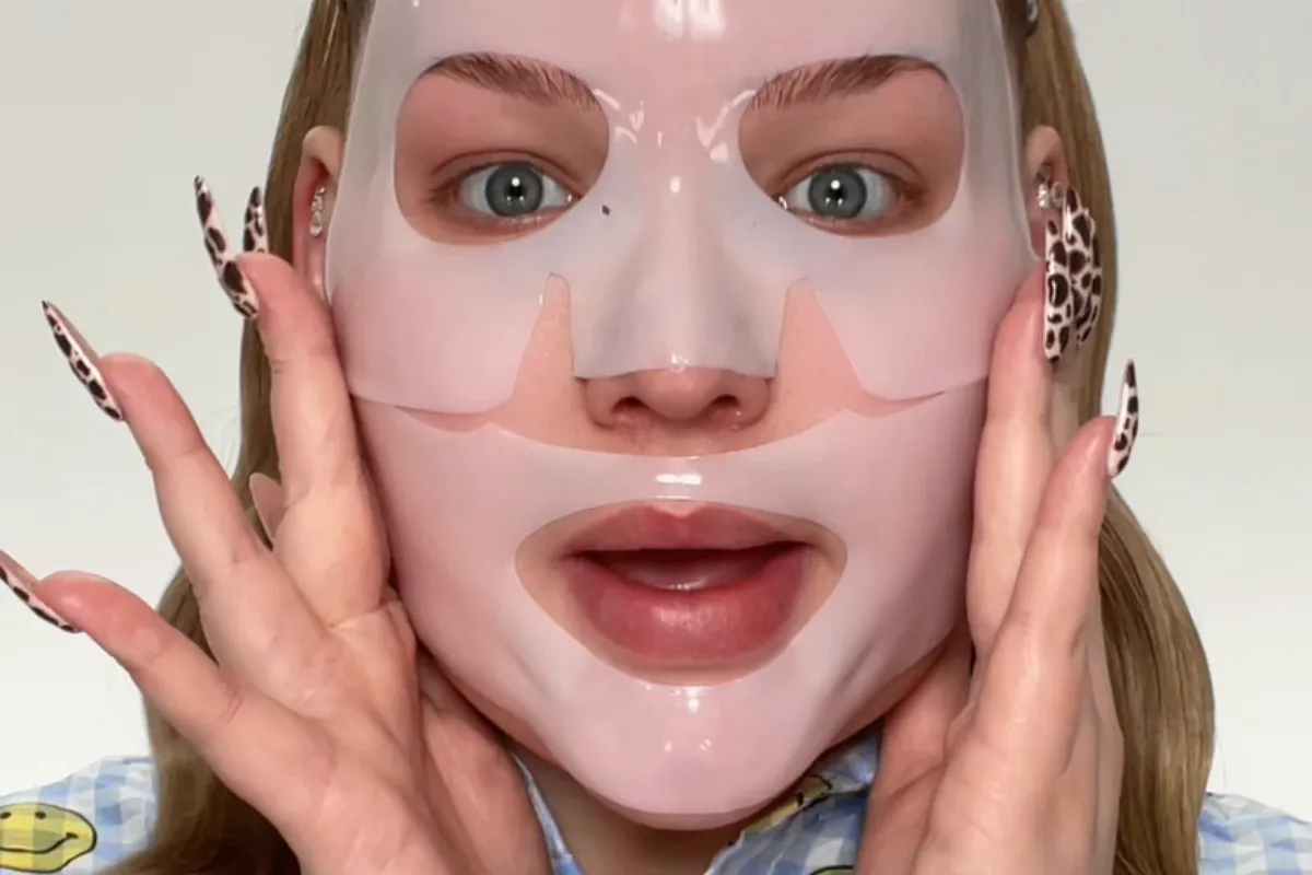 Makeup influencer Nikki Tutorials with a face mask